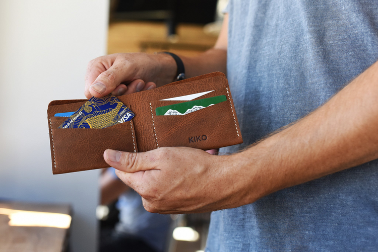 a person holding a wallet