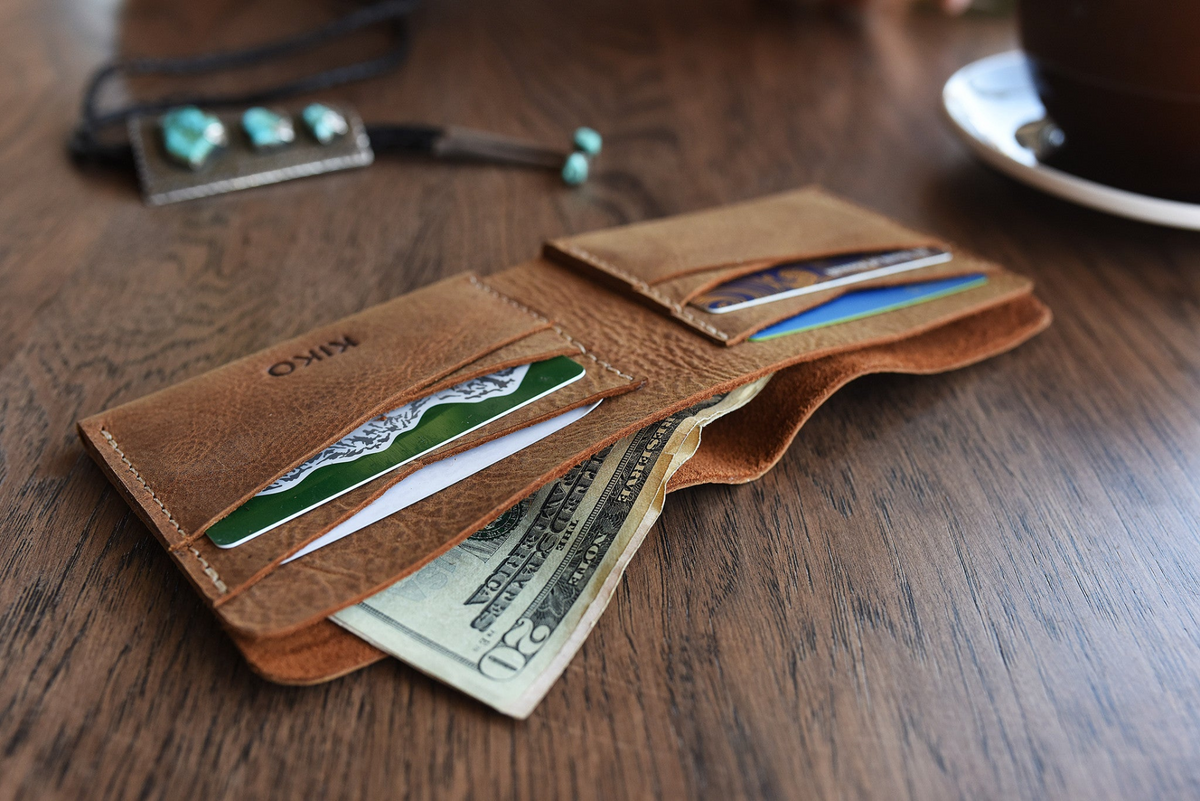 a wallet with money and credit cards