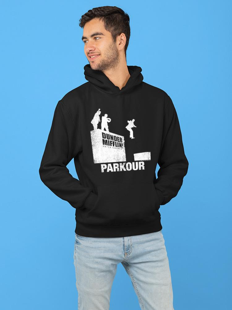 a man wearing a black hoodie