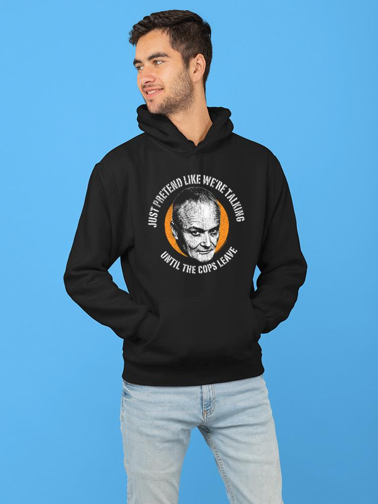 a man wearing a black hoodie
