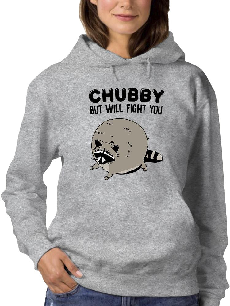 a woman wearing a grey sweatshirt with a raccoon on it