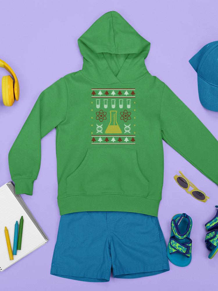a green hoodie with a pattern on it and a pair of blue shorts