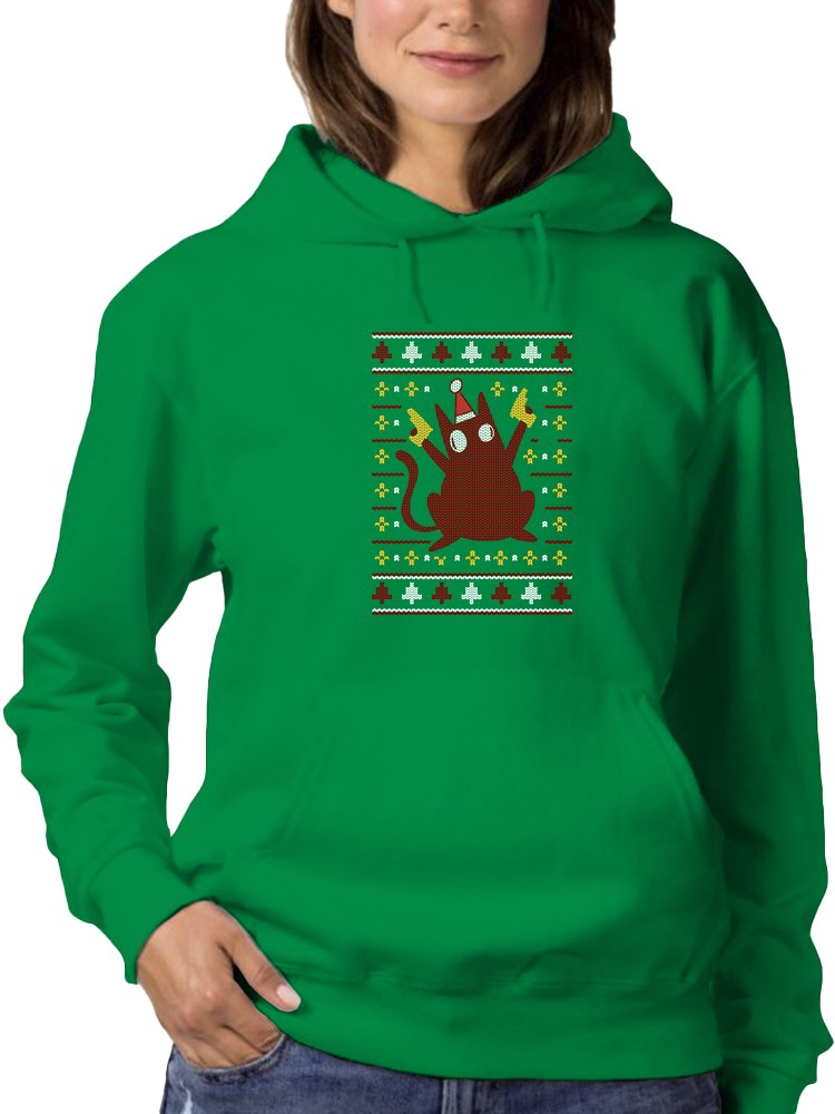 a woman wearing a green sweatshirt