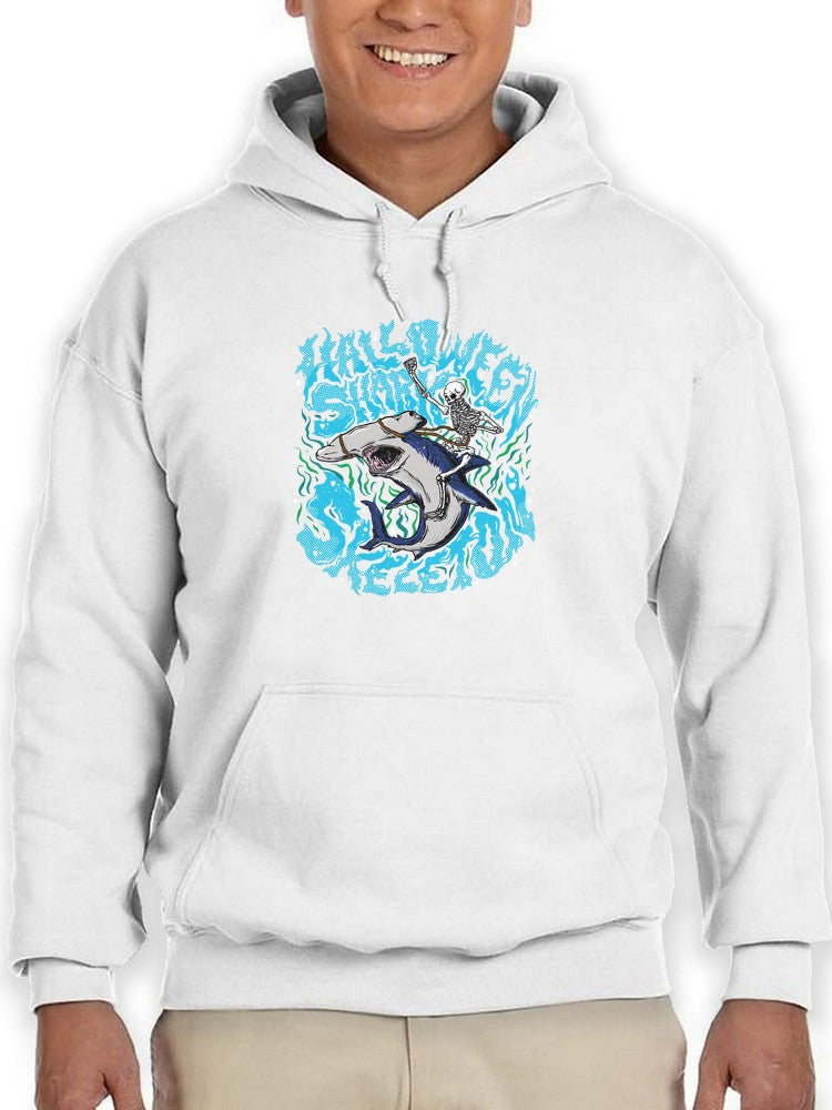 a person wearing a white hoodie with a shark on it