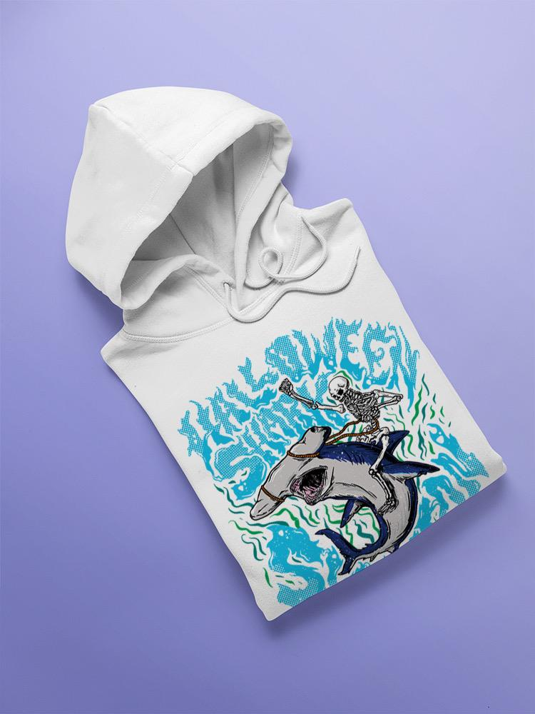a white sweatshirt with a cartoon of a shark riding a shark