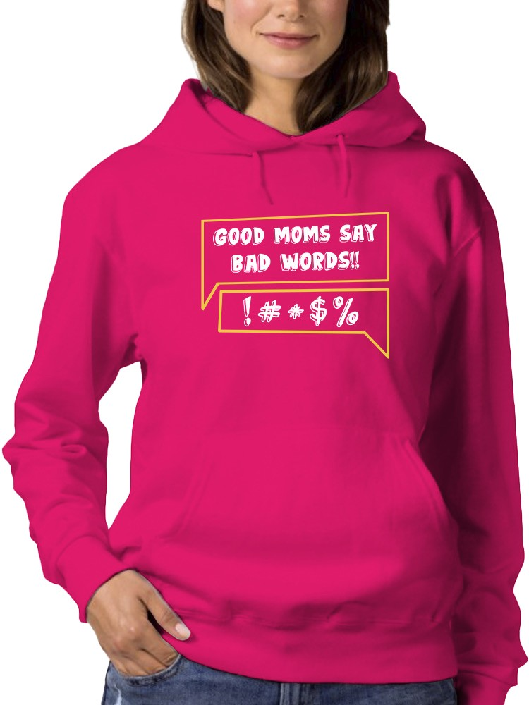 a woman wearing a pink sweatshirt