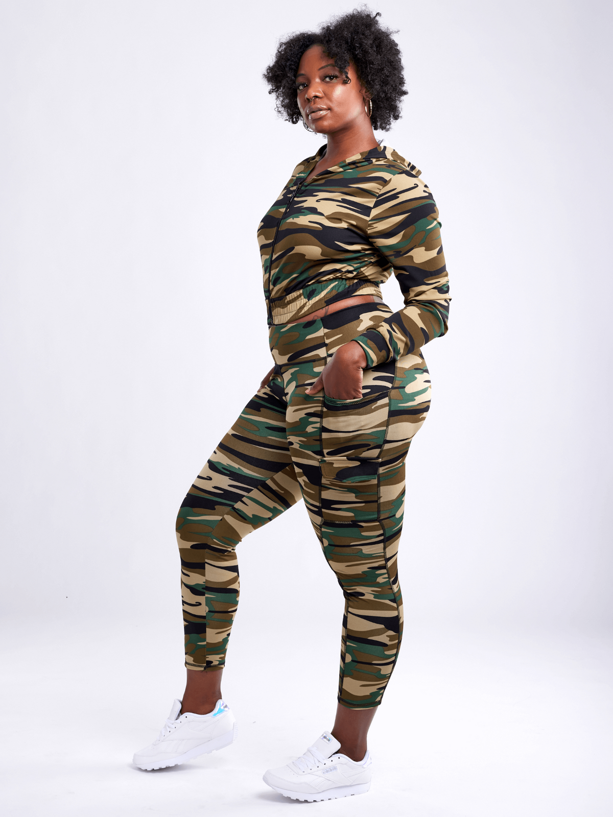 a woman in camouflage outfit