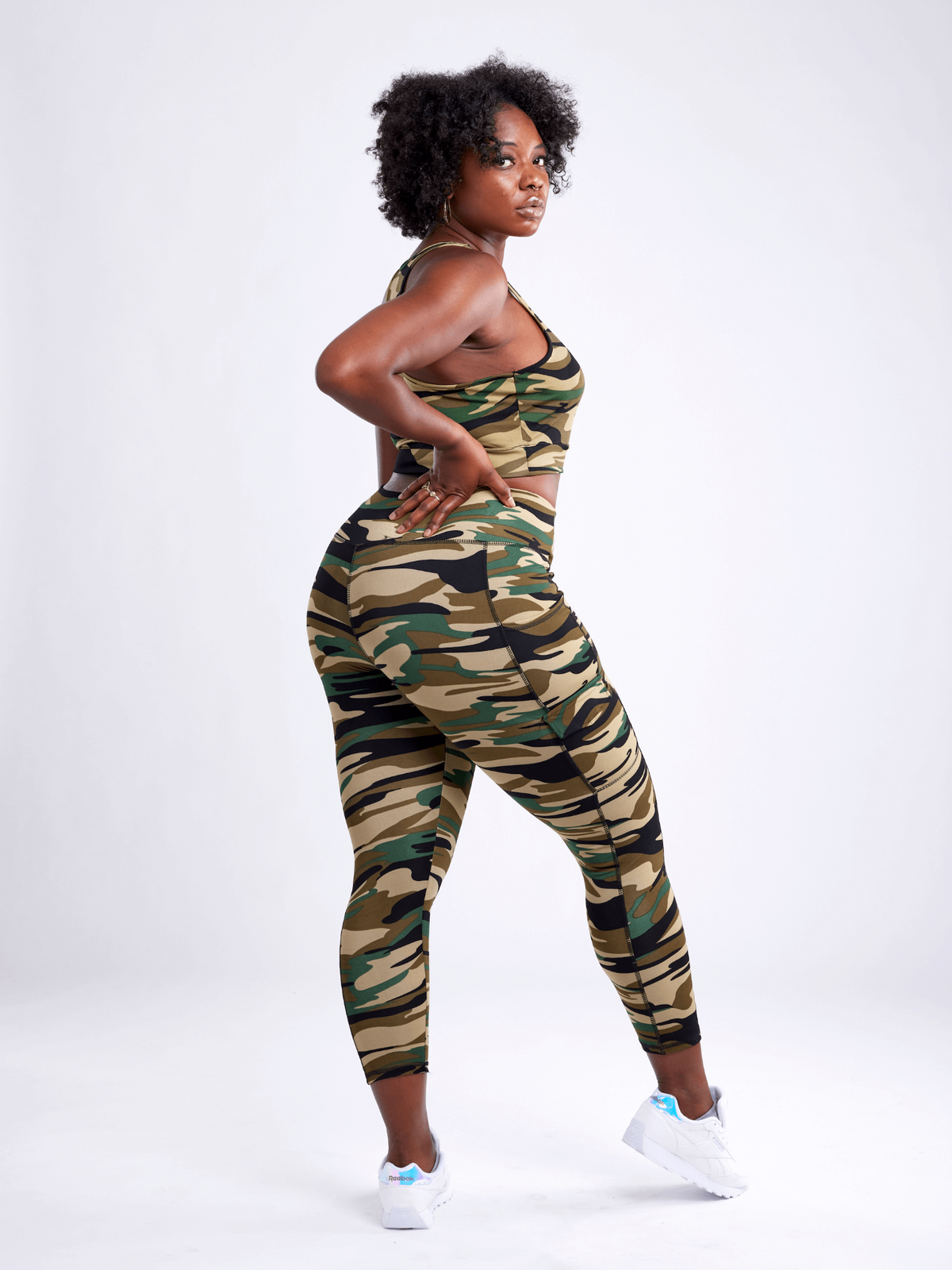 a woman in camouflage outfit