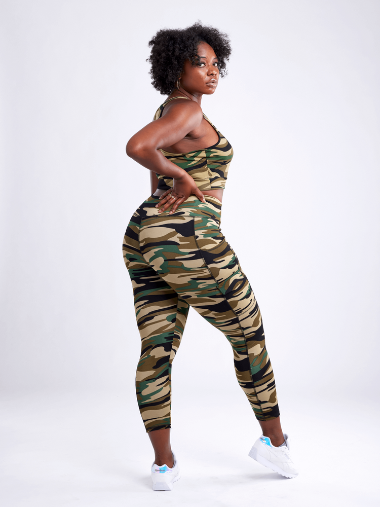 a woman in camouflage outfit