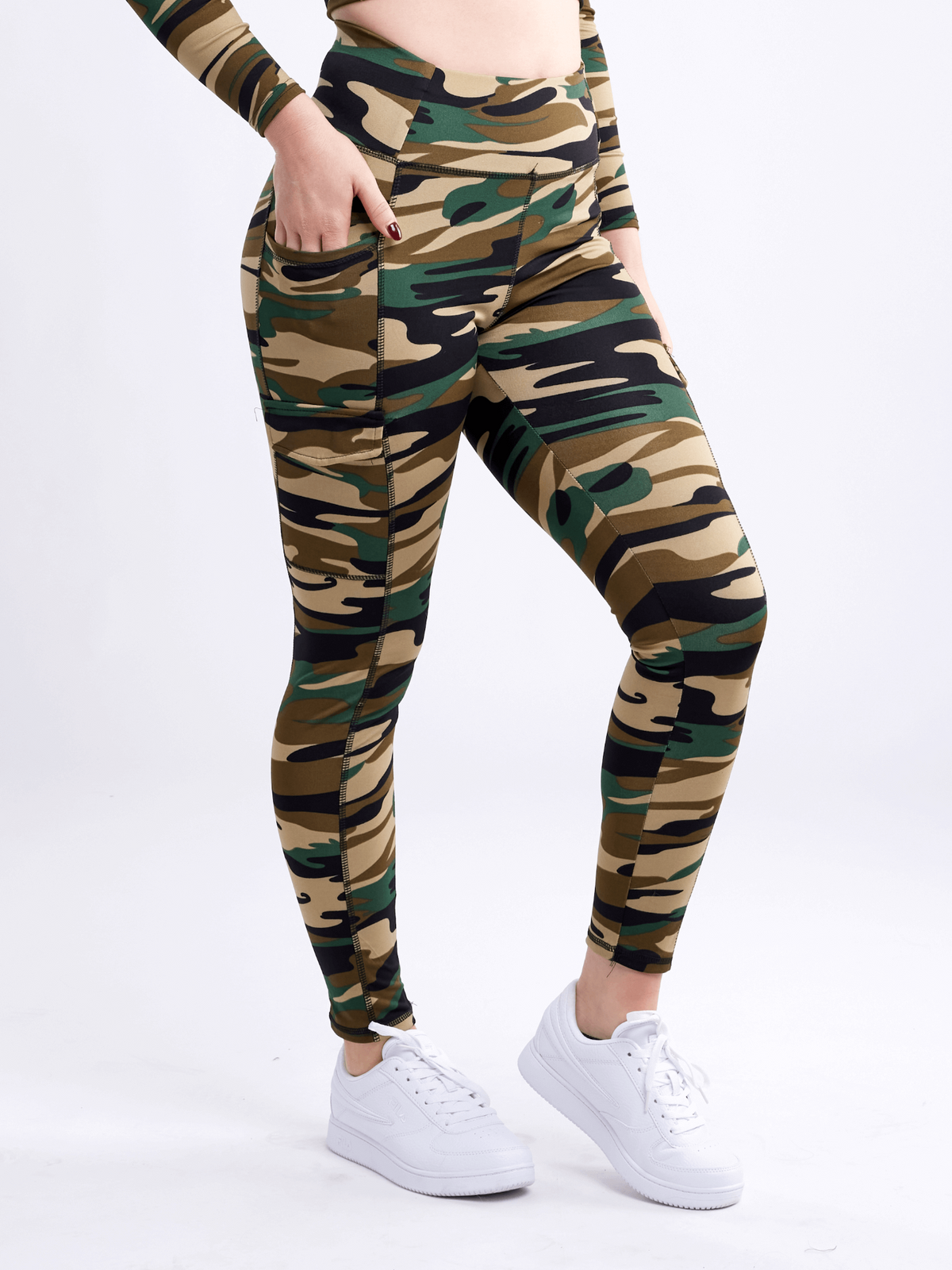 a woman wearing camouflage pants