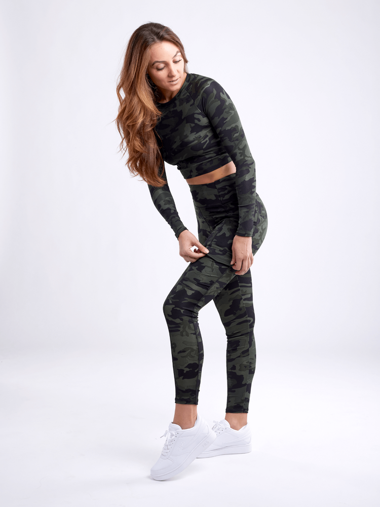 a woman in a camouflage outfit