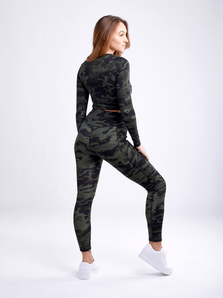 a woman in a camouflage outfit