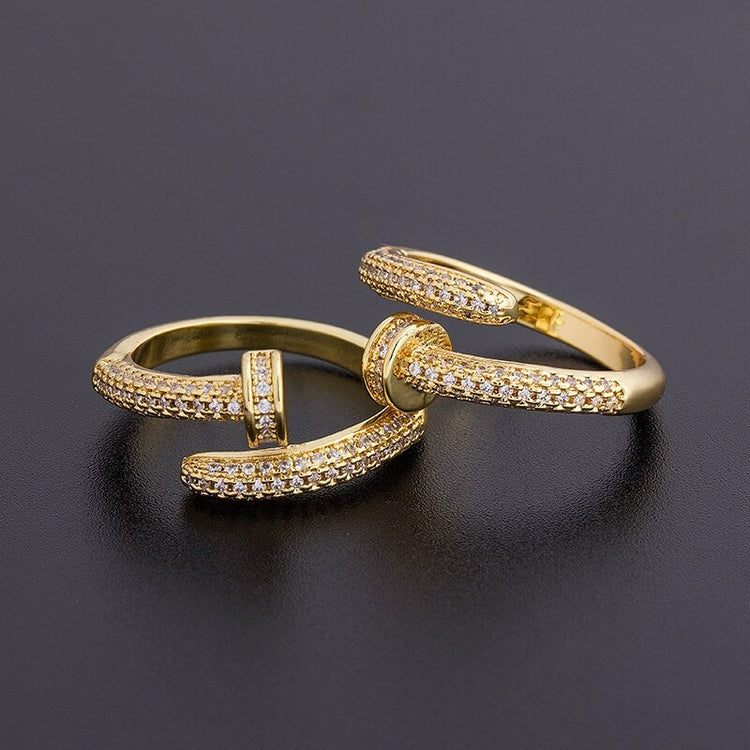 a gold ring with diamonds