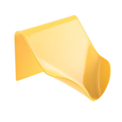 a yellow plastic object on a white background