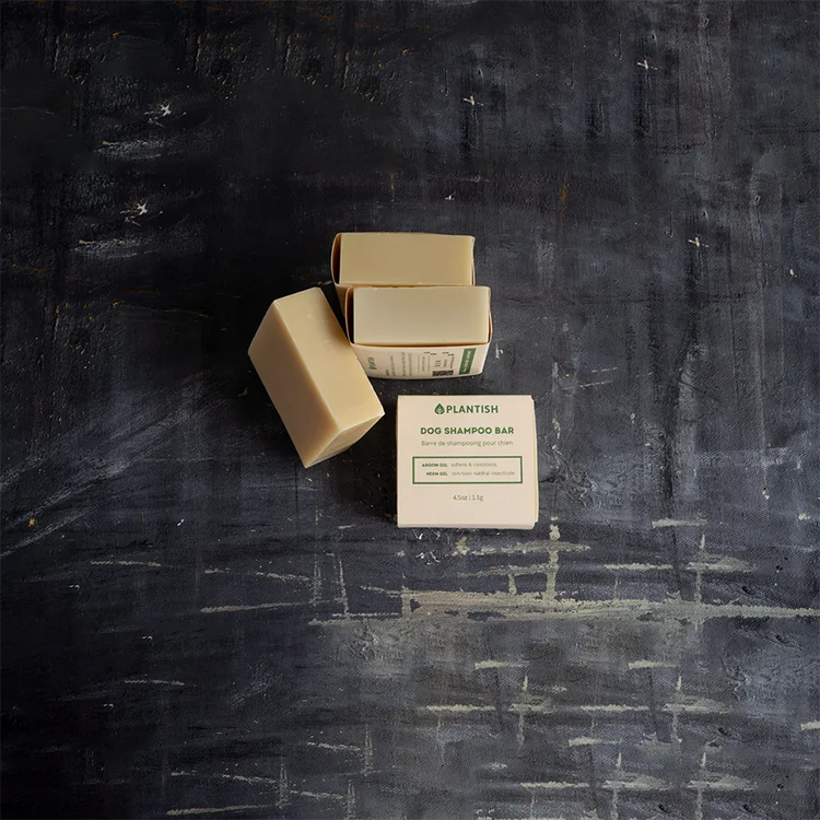 a group of soaps on a black surface