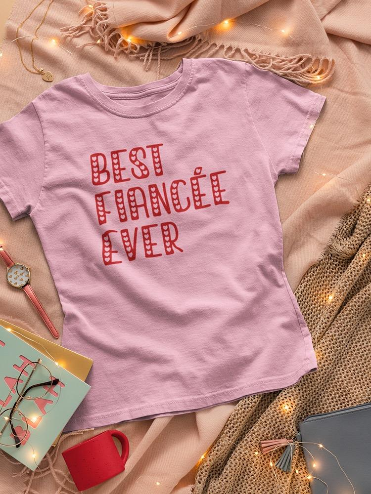 a pink shirt with writing on it