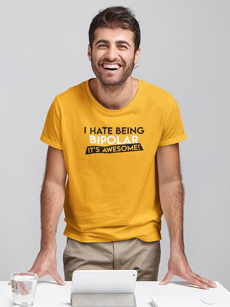a man smiling and wearing a yellow shirt