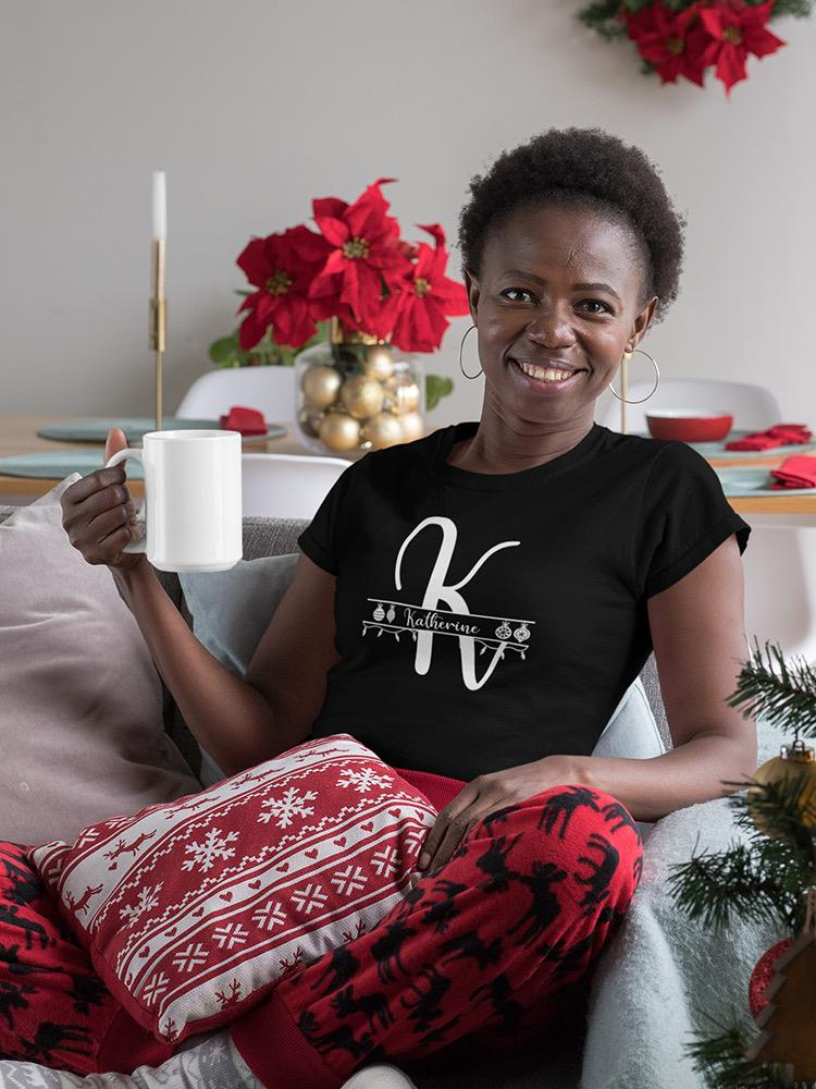 a woman sitting on a couch holding a white mug
