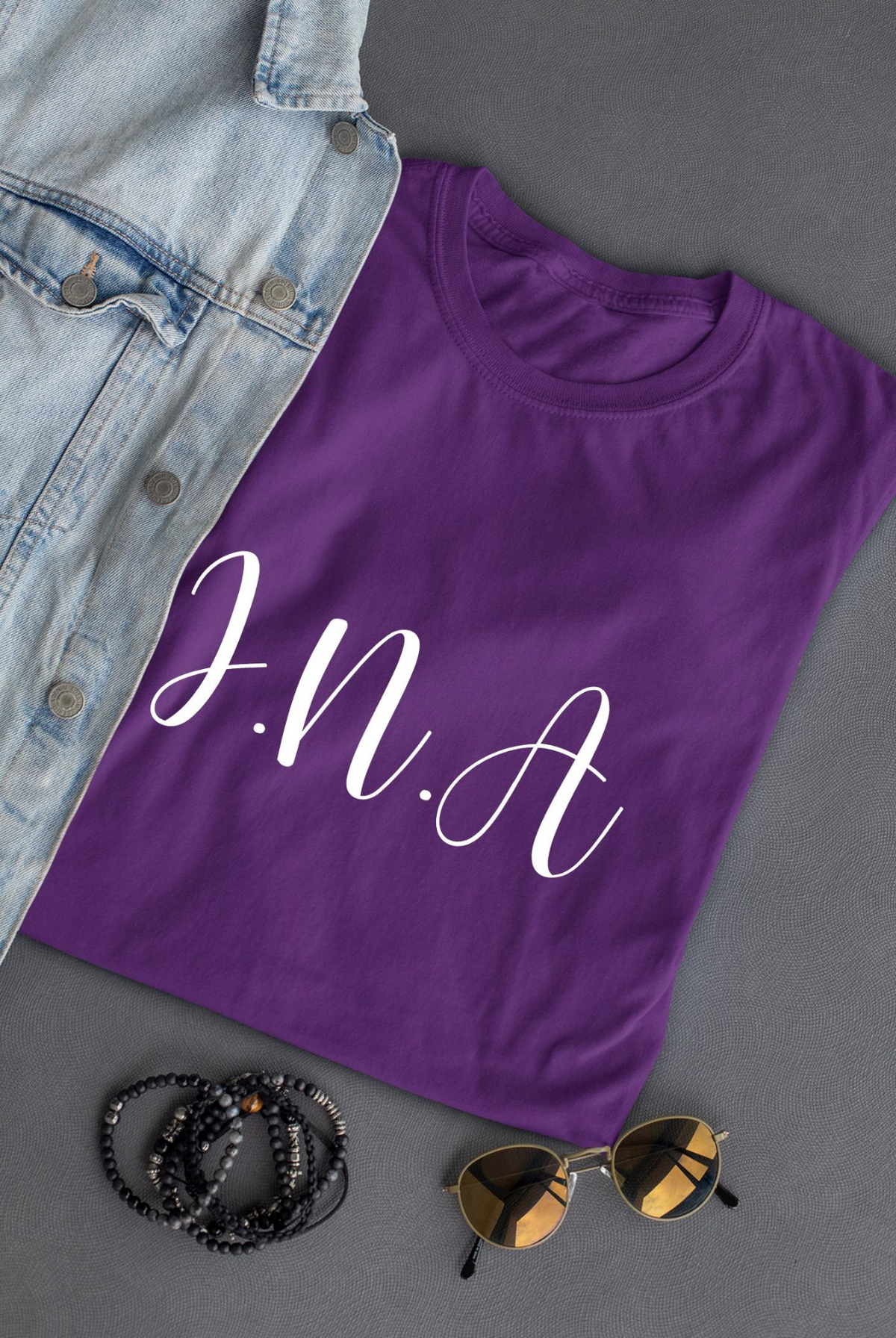 a purple shirt with white text on it