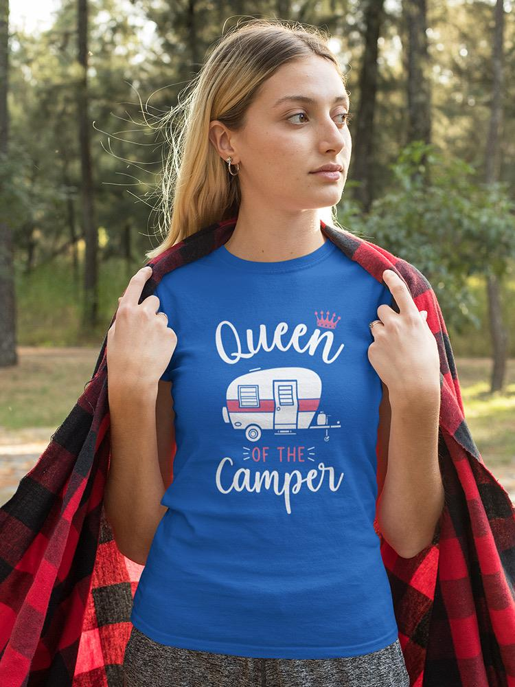 a woman in a blue shirt with a red blanket on her shoulders