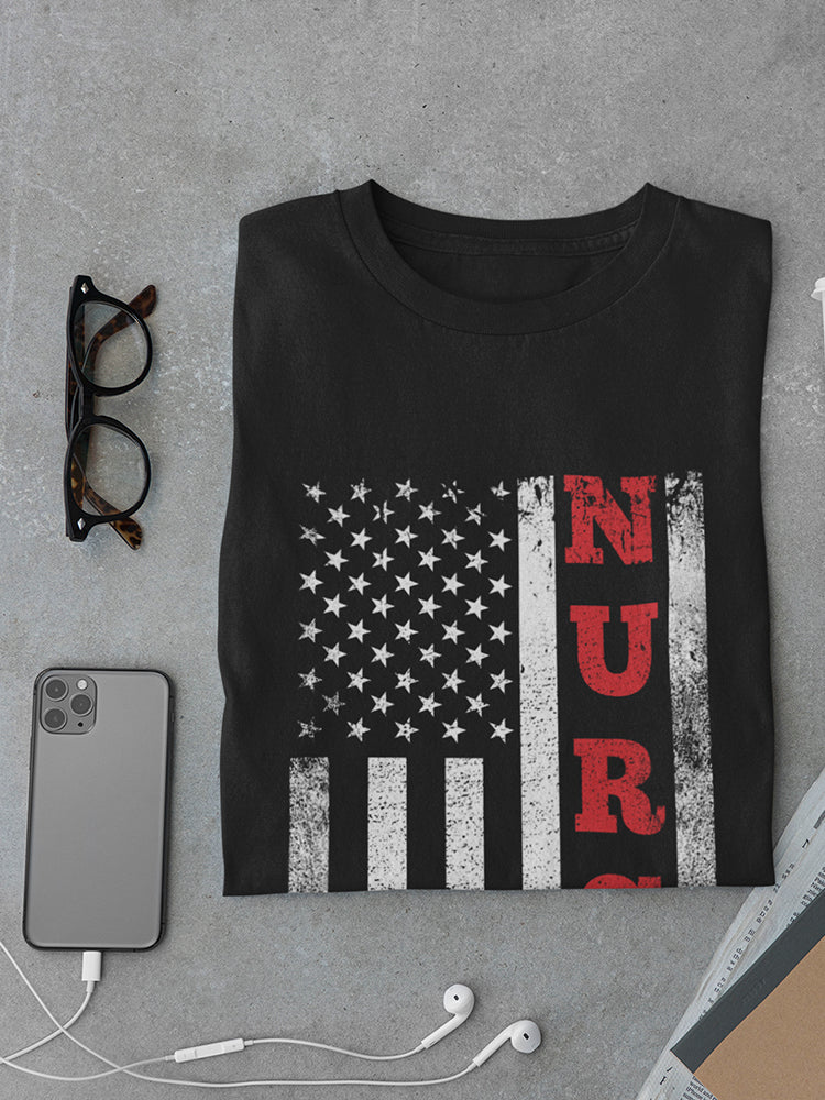 a black shirt with a flag and a phone and glasses