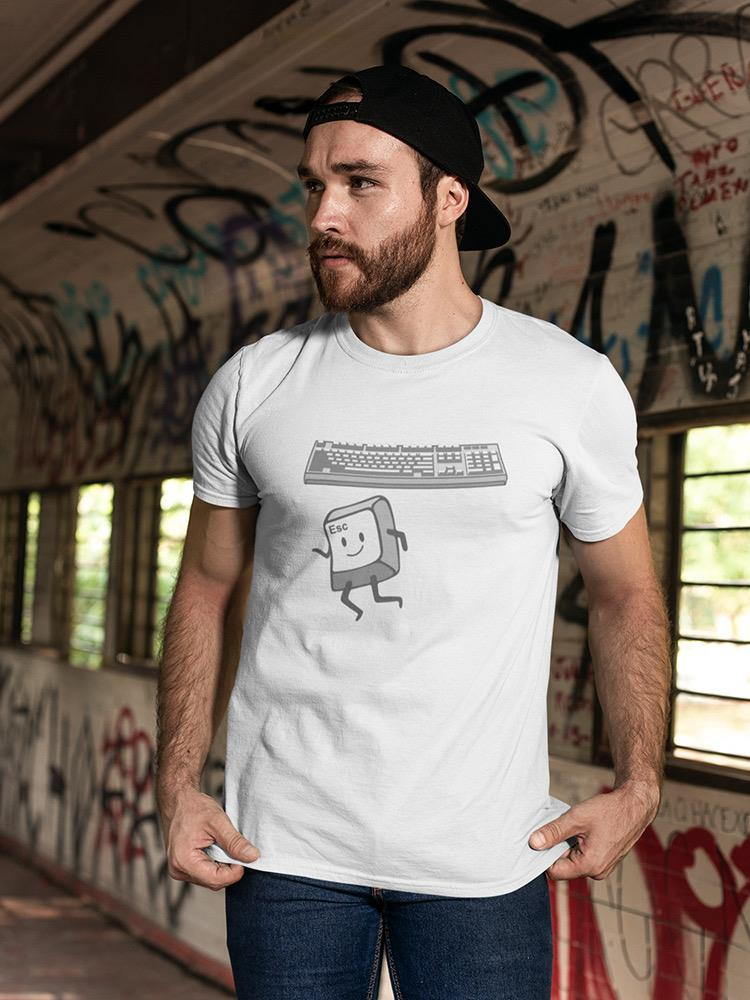 a man wearing a hat and a white shirt with a cartoon character on it