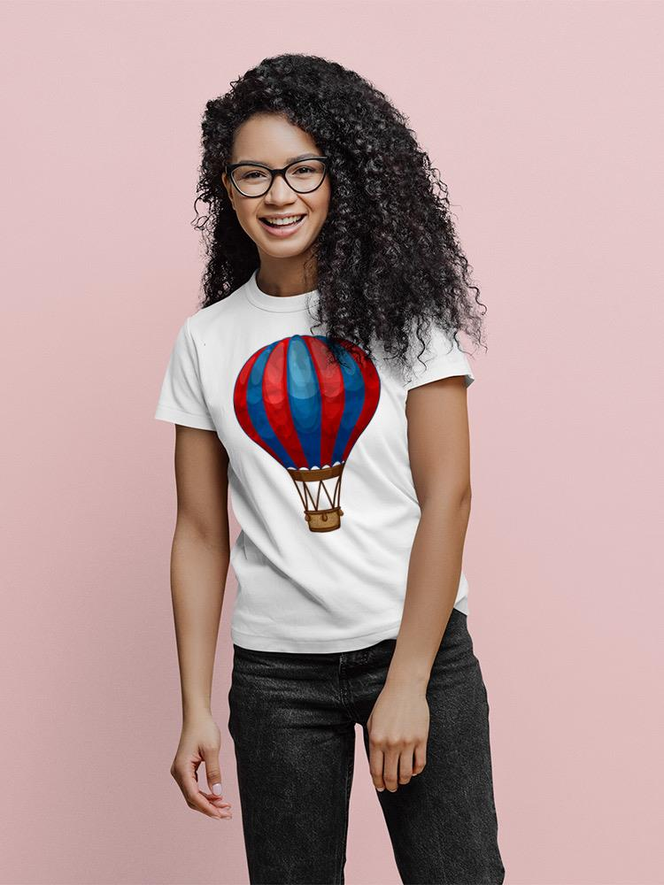 a woman wearing glasses and a white shirt with a hot air balloon on it