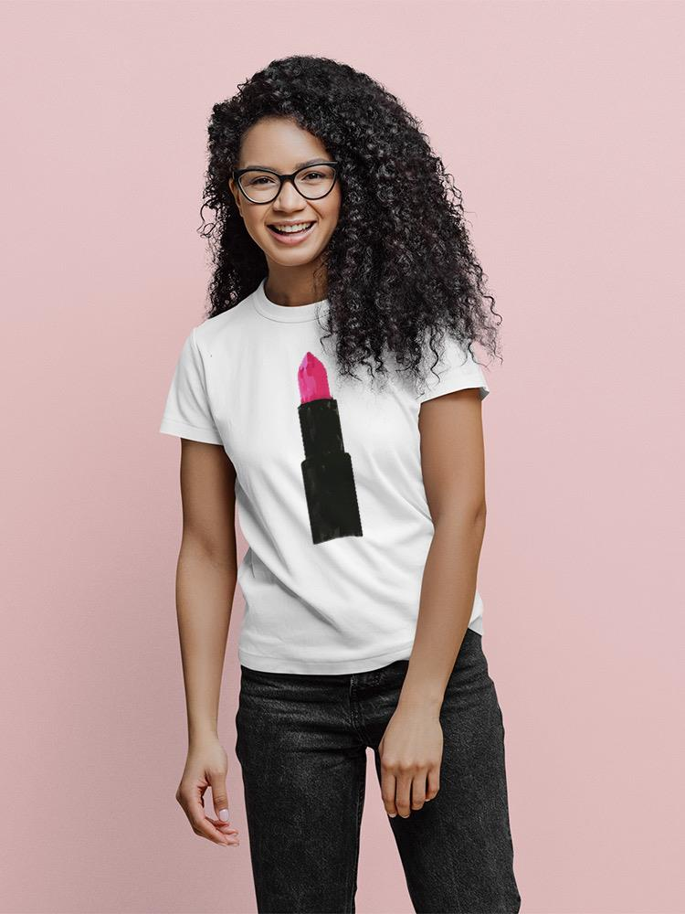 a woman smiling with a pink lipstick on her shirt