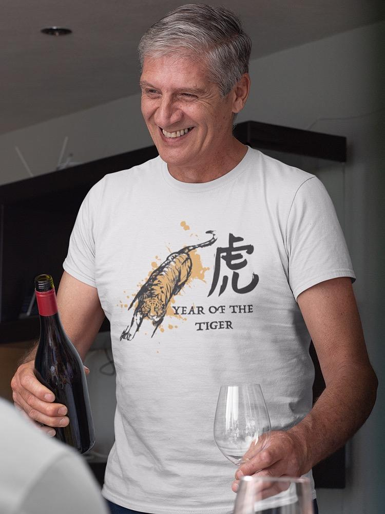 a man holding a wine bottle and a glass