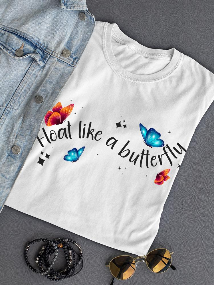 a white shirt with butterflies on it
