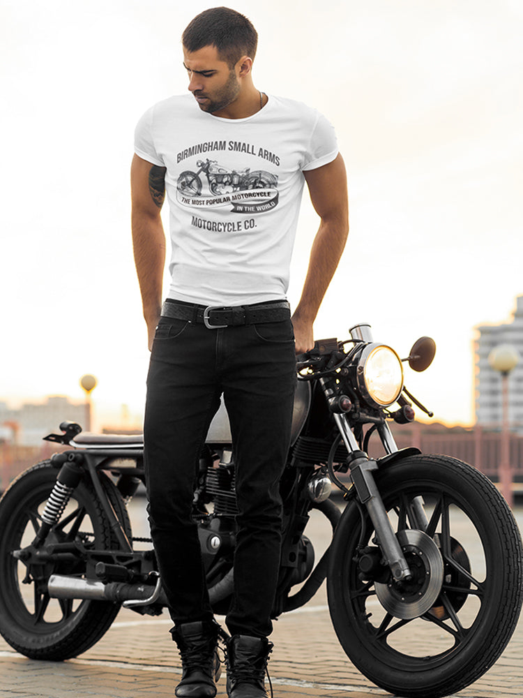 a man standing next to a motorcycle