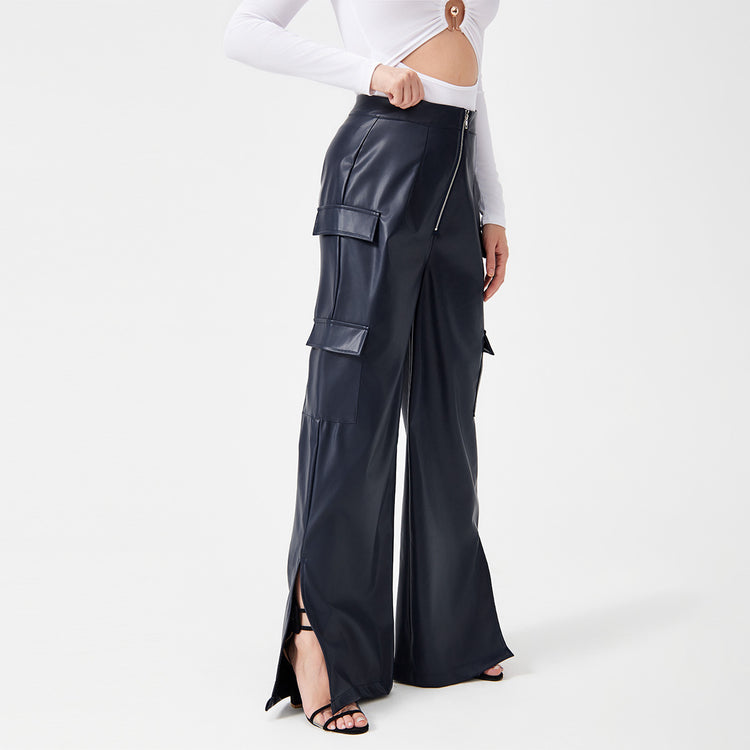 a woman wearing a white shirt and black pants