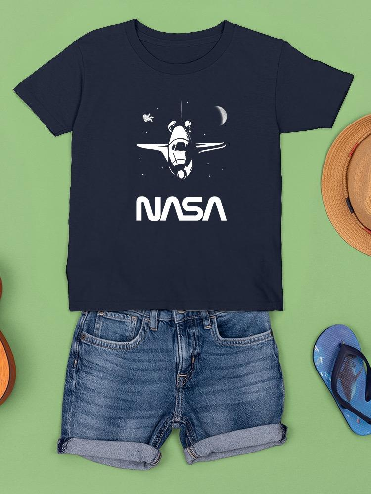 a blue shirt and shorts on a green surface