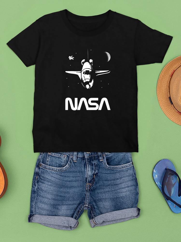 a black shirt and shorts on a green surface