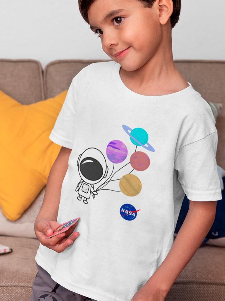 a boy holding a card and a picture of a space astronaut