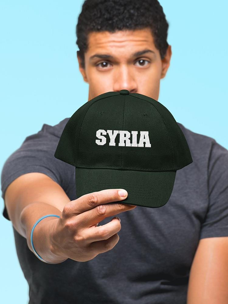 a man holding a hat