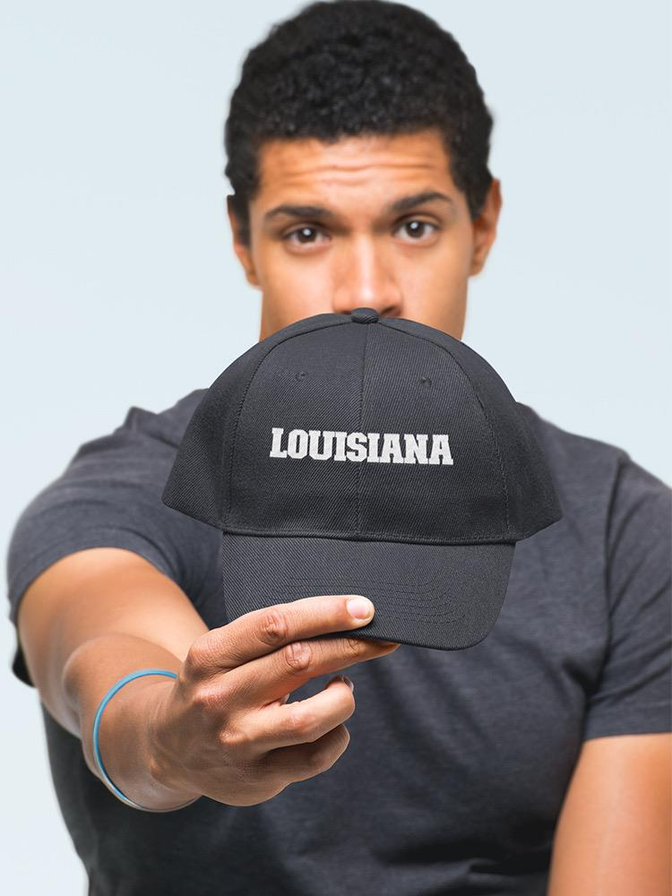 a man holding a hat