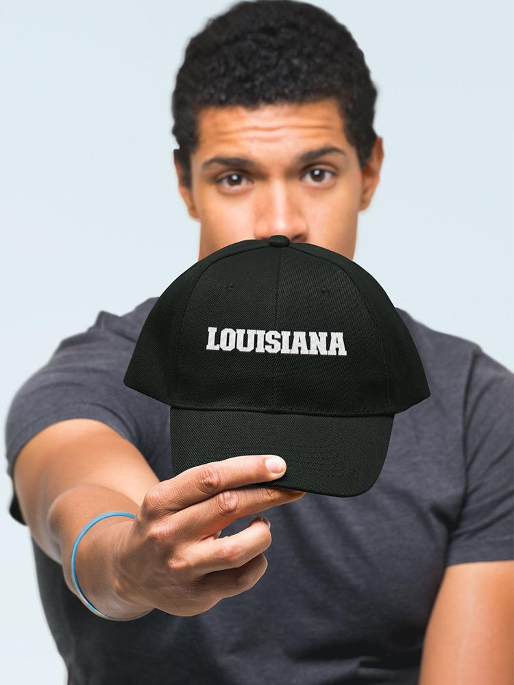 a man holding a black hat