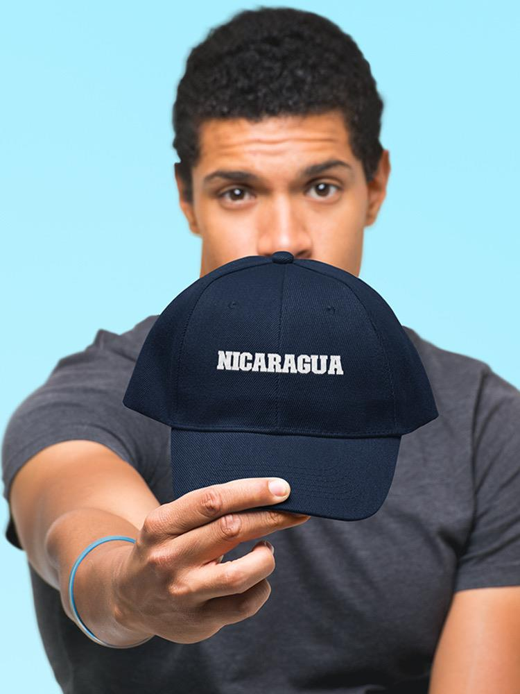 a man holding a hat