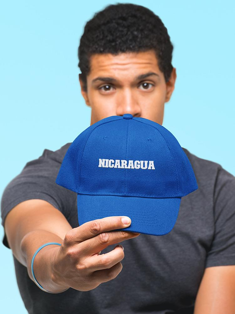 a man holding a blue hat