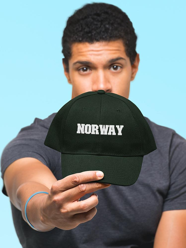 a man holding a black hat