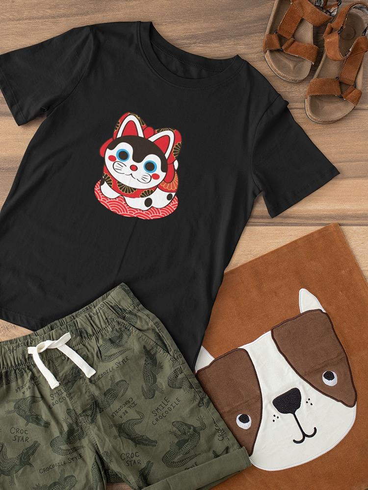 a black shirt and shorts on a wooden surface