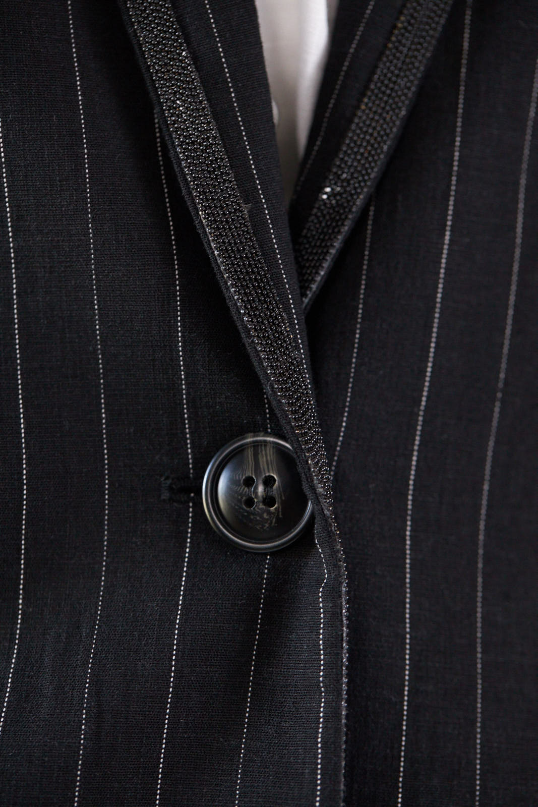 a close up of a button on a suit