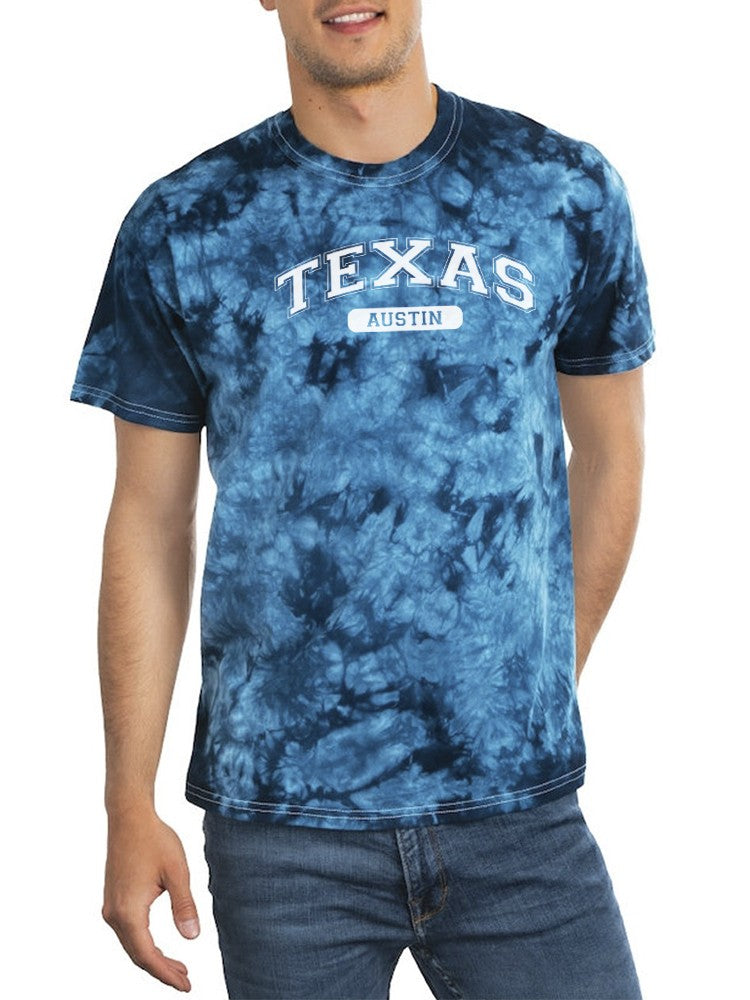 a man wearing a tie dye shirt