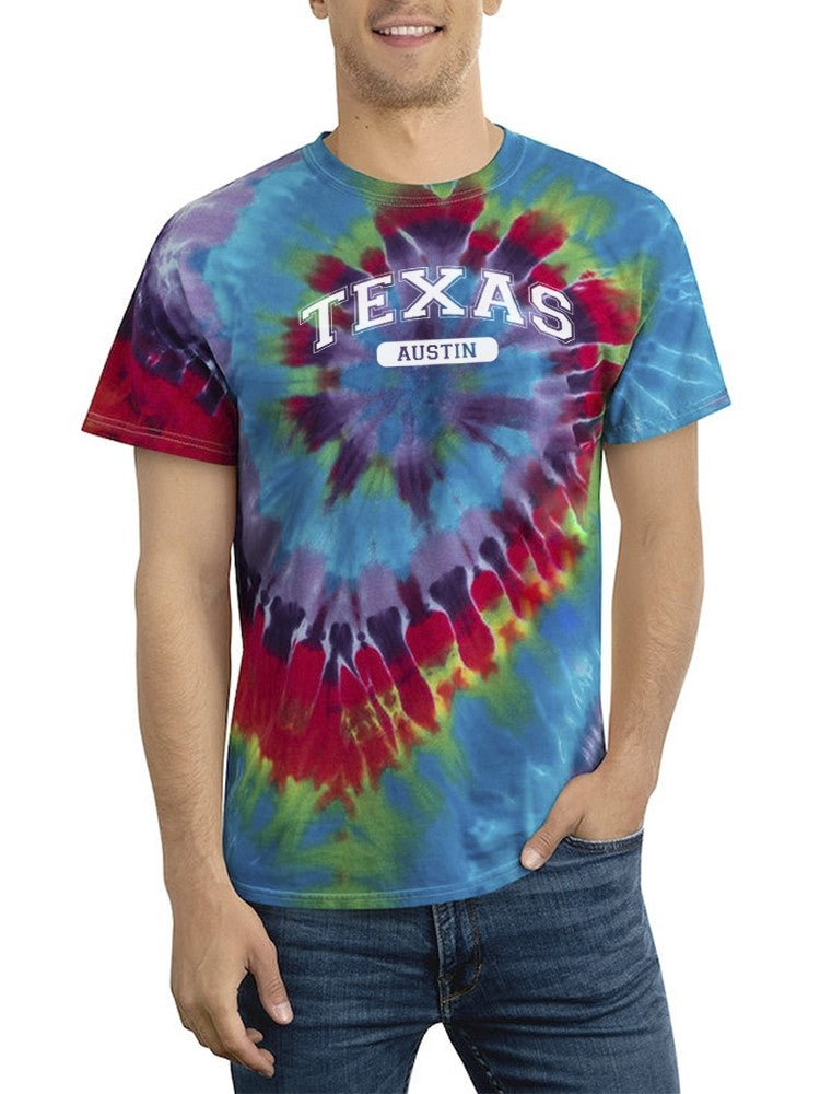 a man wearing a tie dye shirt