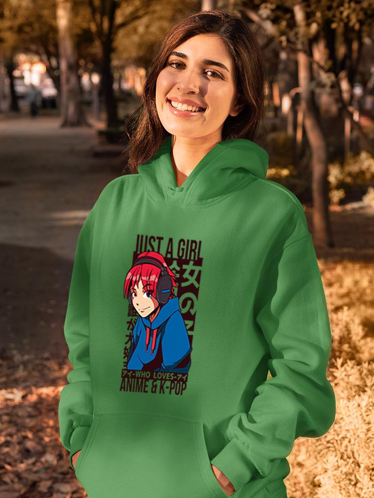 a woman wearing a green hoodie