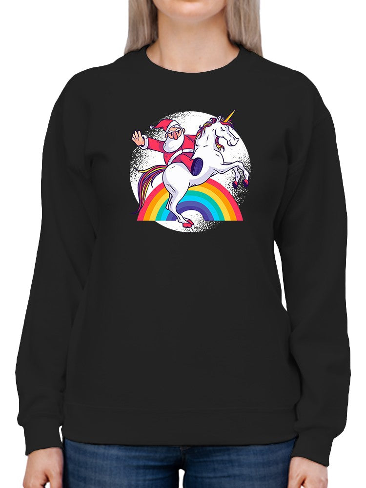 a person wearing a black sweatshirt with a cartoon of santa riding a unicorn