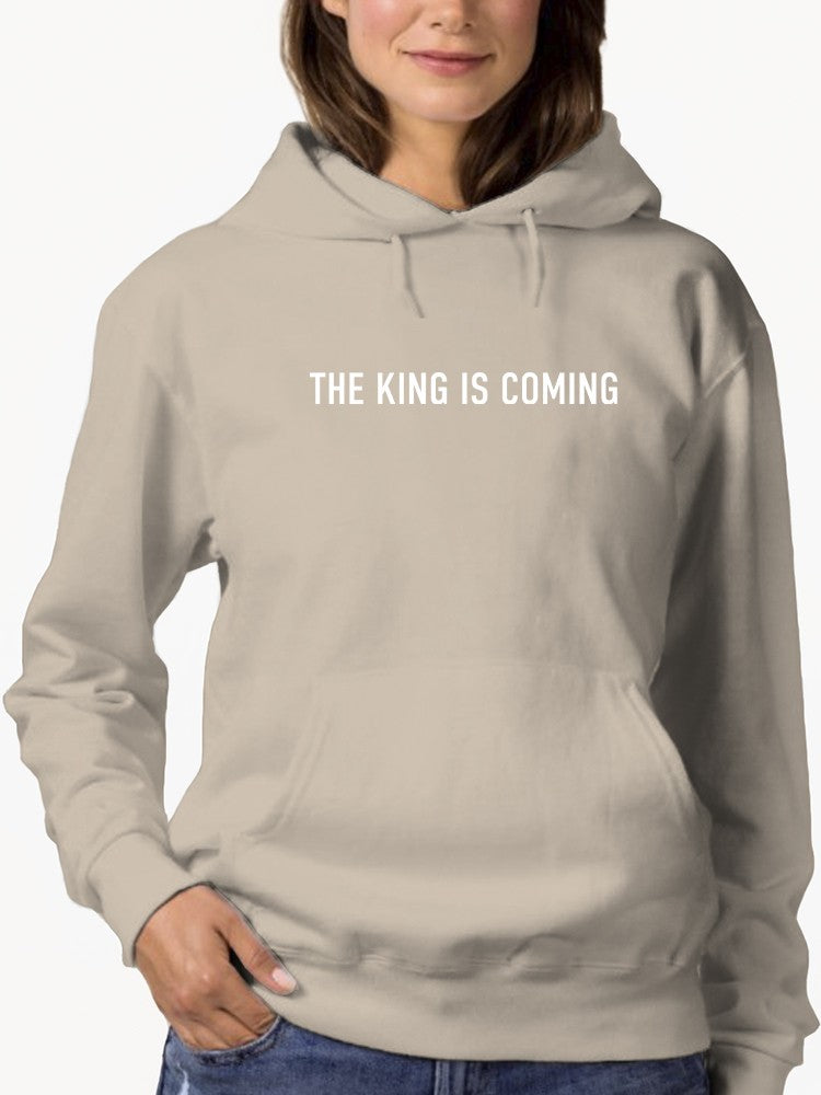 a woman wearing a grey hoodie