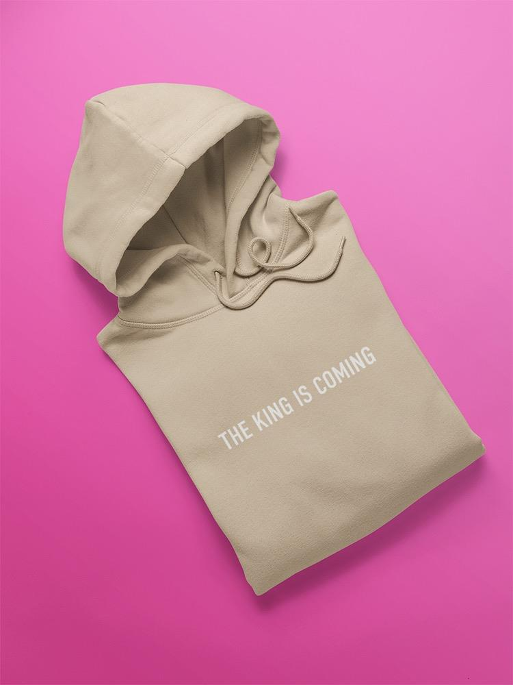 a beige hoodie on a pink background