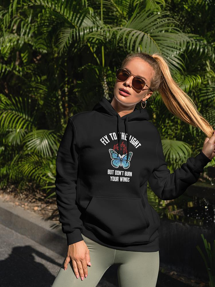 a woman wearing sunglasses and a black hoodie